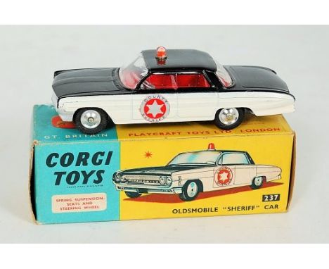 Corgi Toys, 237 Oldsmobile 'Sheriff' car, black body with cream side panels, red interior with roof light, 'County Sheriff', 