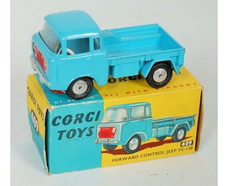 Corgi Toys, 409 forward control Jeep, light blue body with red grille, flat spun hubs, in the original blue and yellow all-ca