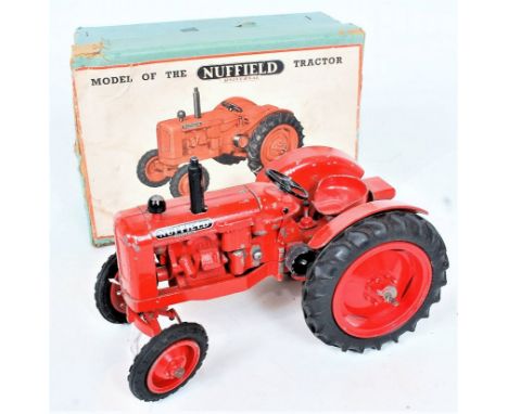 Denzil Skinner for Morris Motors, model of the Nuffield Universal Tractor, finished in red with black rubber tyres, with stac