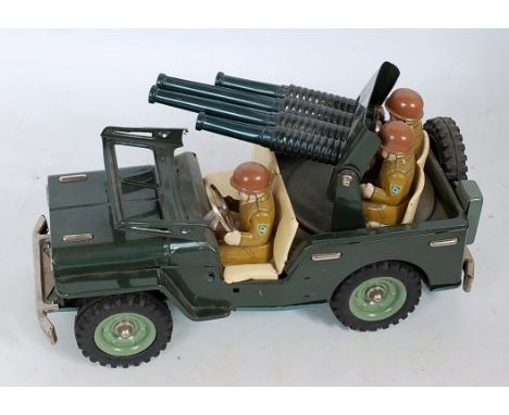 SSS Toys of Japan, tinplate and friction drive Anti Aircraft Jeep, comprising green body with light green hubs, driver, rotat