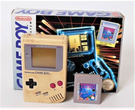 An original boxed Gameboy Compact Video Game System, boxed with Tetris Game, console is dis-coloured