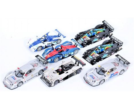 7 various loose Scalextric Slot Racing Cars, all in racing liveries, to include 2x Lister Storm LMP "Laser Hand Tools", 2x Me