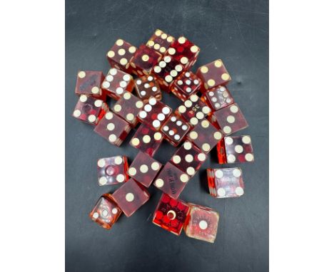 A selection of croupiers or casino style red resin dice.