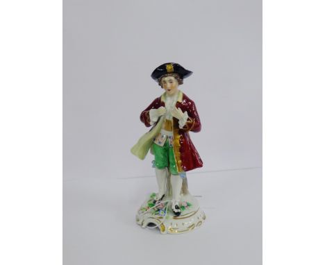A continental porcelain figure of a Gent modelled standing in frock coat on a Rococo style gilt edged base, 15cm high