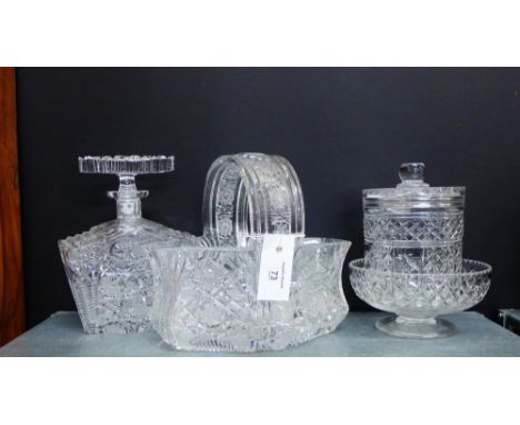 A collection of crystal to include a spirit decanter and stopper, a basket, a bowl and a biscuit barrel and cover, (4) 