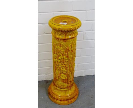 A yellow glazed English pottery jardiniere stand with Sunflower pattern