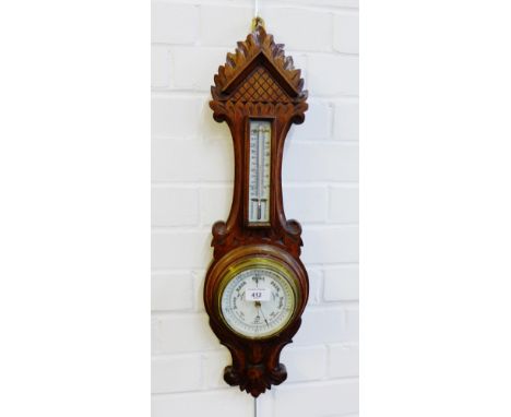 An oak cased wall barometer