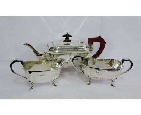 George VI silver teaset comprising teapot, milk jug and twin handled sugar bowl, makers marks for John Rose, Birmingham 1939 