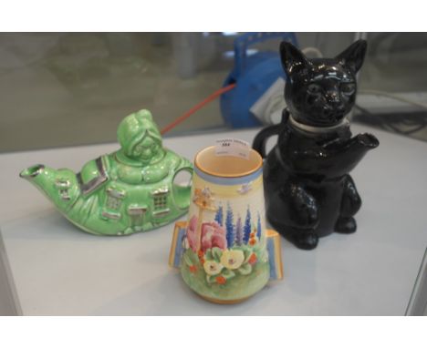 A Royal Winton Deco vase; together with a teapot in the form of a black cat and a teapot in the form of a lady in a shoe