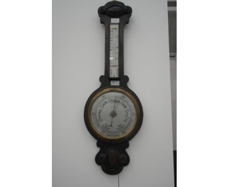 A 1920s oak barometer