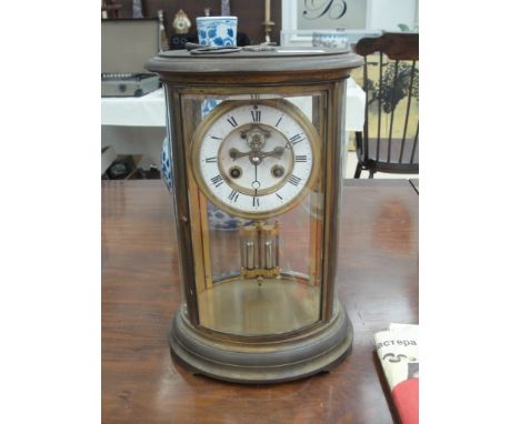 A 19th century brass & glass cased mantel clock with mercury pendulem movement by J Marti striking on a bell