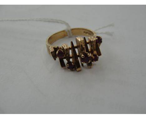 A 9ct abstract ruby set ring, size Q, c1970
