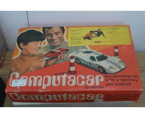 A boxed Computacar vintage car game with accessories and others