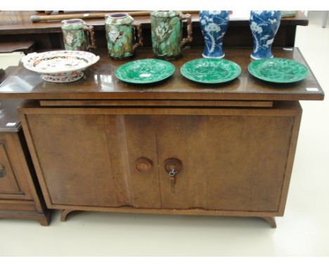 A walnut Art Deco sideboard with pull-out shelf