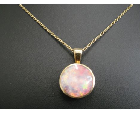 A 9ct chain and large backed opal pendant