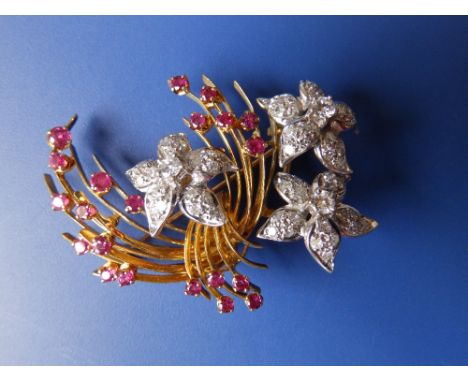 A diamond & ruby set 18ct gold en tremblant floral spray brooch, having three diamond set white metal flowerheads- BR Ld, Lon