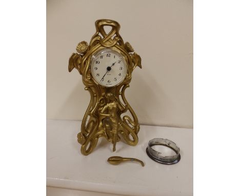 An art nouveau gilt metal mantel clock fitted with modern quartz movement – case a/f..