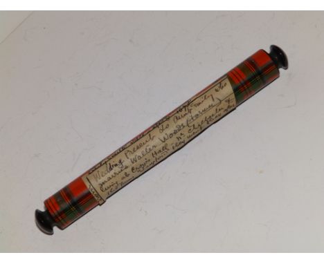 A mauchline ware miniature rolling pin.