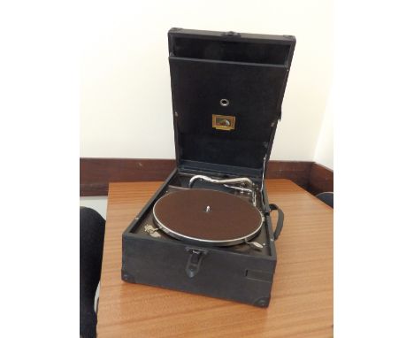 An HMV 101 wind-up record player, circa 1925, together with a small number of records.