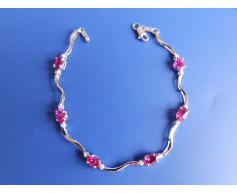 A modern ruby set white gold bracelet.