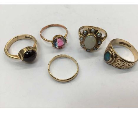 Five gold and gem-set dress rings to include a cabochon garnet single stone ring, opal and seed pearl ring, opal single stone