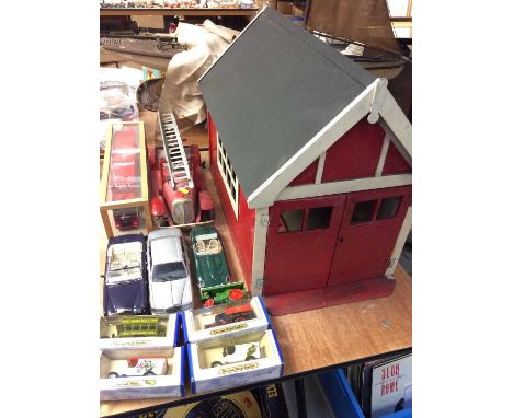 Group toy cars including tin plate fire engine and wooden fire station