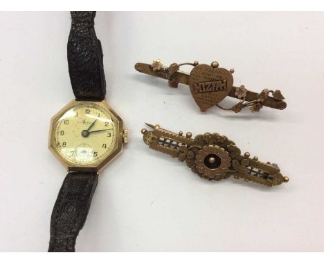 Vintage 9ct gold cased ladies Avia wristwatch on black leather strap and two Victorian 9ct gold bar broochesCondition report:
