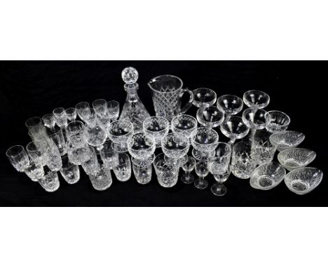 A large quantity of cut glass to include a pitcher, a decanter and sherry glasses (qty).