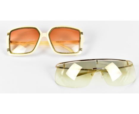 TED LAPIDUS PARIS; a pair of vintage 1970s ivory coloured oversized sunglasses with gold tone roped edging, and light amber l