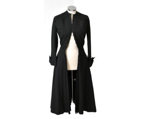 CHRISTIAN DIOR; a 1940s vintage 100% black wool button down tailored coat dress with side pockets, full net underskirt and li