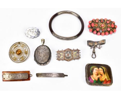 A small group of costume jewellery to include a filigree decorated brooch, a coral set brooch, Edwardian silver brooch, bangl