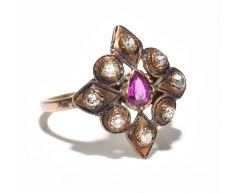 A 19th century yellow metal diamond set enamelled ring of pierced lozenge form centred with a pear cut pink stone within a fr