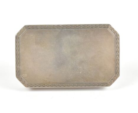 A 20th century 925 grade silver snuff box of rectangular form with canted corners and engine turned engraved detail, the spru