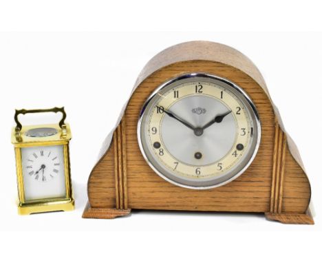 A early 20th century French brass cased carriage clock, the enamel dial set with Roman numerals, together with a Garrard Art 