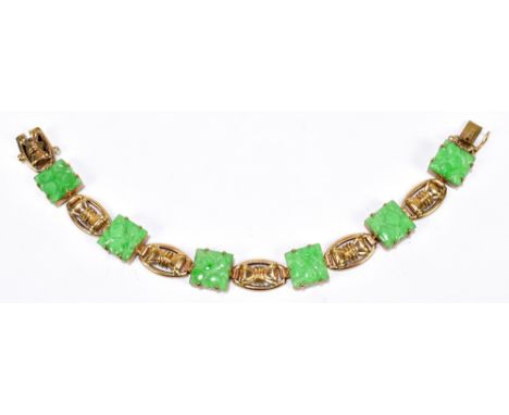 A 9ct yellow gold and jade bracelet formed of six carved square jade panels between five pierced oval gold panels, length 18c