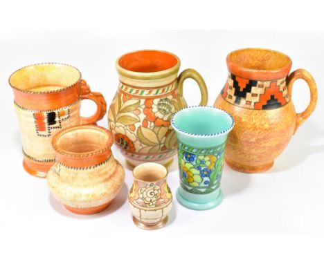 CHARLOTTE RHEAD FOR CROWN DUCAL; three pieces including two single handled vessels and a trumpet vase, on a green ground, hei