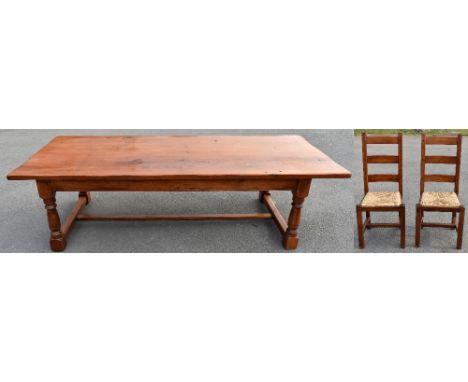 A large reproduction oak refectory table, raised on turned columns and block feet, length 274cm, depth 110cm, height 77cm, to