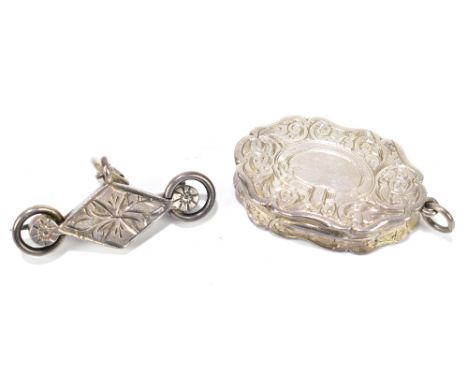 NEILL &amp; COOK; an early to mid Victorian hallmarked silver vinaigrette of shaped oval form, the lid with vacant oval panel