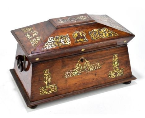 A William IV mother of pearl inlaid rosewood sarcophagus shaped tea caddy, decorated throughout with dragons and foliate moti
