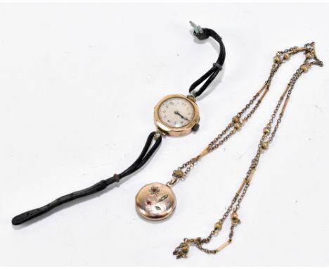 A lady's gold cased wristwatch, the circular dial set with Arabic numerals and engine turned type decoration, with leather an