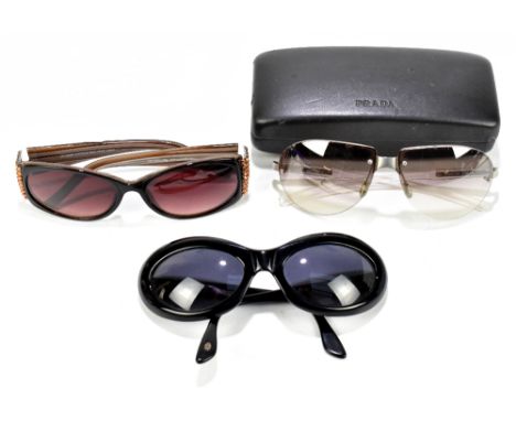 PRADA; a pair of vintage sunglasses with clear plastic arms and brown tinted lenses in original authentic case, a pair of bro