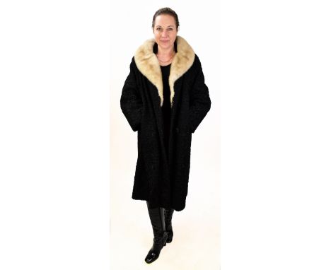 A vintage Astrakan sheepskin full length coat with cream fur collar, two front original swirl design button fasteners and lin