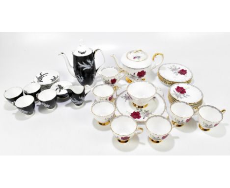 ROYAL STAFFORD; a part tea service decorated in the 'Roses to Remember' pattern, and an Royal Albert 'Night and Day' part tea