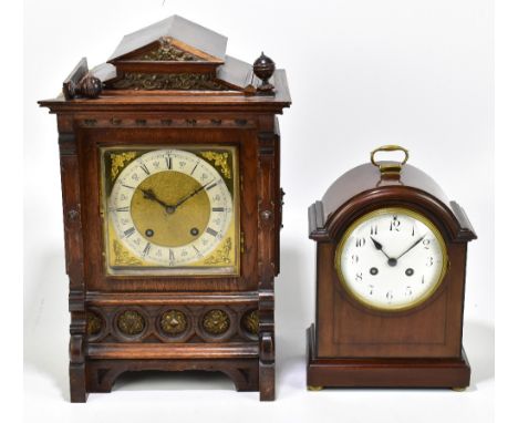 LENZKIRCH; an early 20th century oak cased German mantel clock, with carved detail to the case surrounding the gilt metal fac