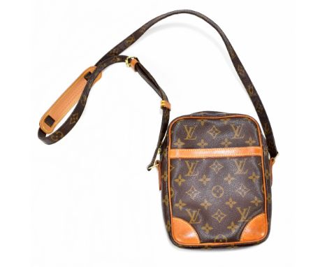 LOUIS VUITTON; a monogram MM Danube leather brown cross body handbag with tan leather trim, long shoulder strap with leather 