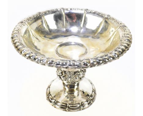 A German 800 grade pedestal comport with panelled bowl above fruit embossed central column and spreading circular foot, diame