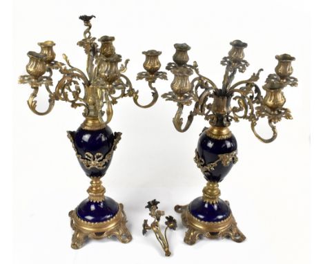 A pair of decorative early 20th century gilt metal and ceramic candelabra with floral detail, height 47cm (2).Additional Info