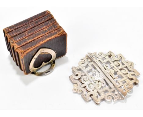 WILLIAM HAIR HASELER; a late Victorian hallmarked silver buckle, Birmingham 1899, and an Edwardian hallmarked silver book rac