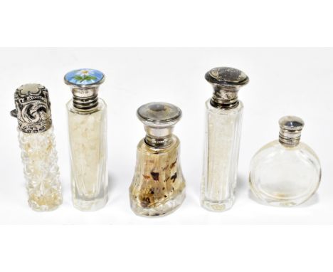 M. BROS; a George VI hallmarked silver and enamel mounted smelling salts bottle, with faceted glass body and floral detail to