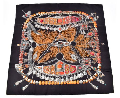 HERMÈS; a 100% silk 'Terres Precieuses' scarf designed by Annie Faivre, 2002, depicting gems and jewellery from different cul